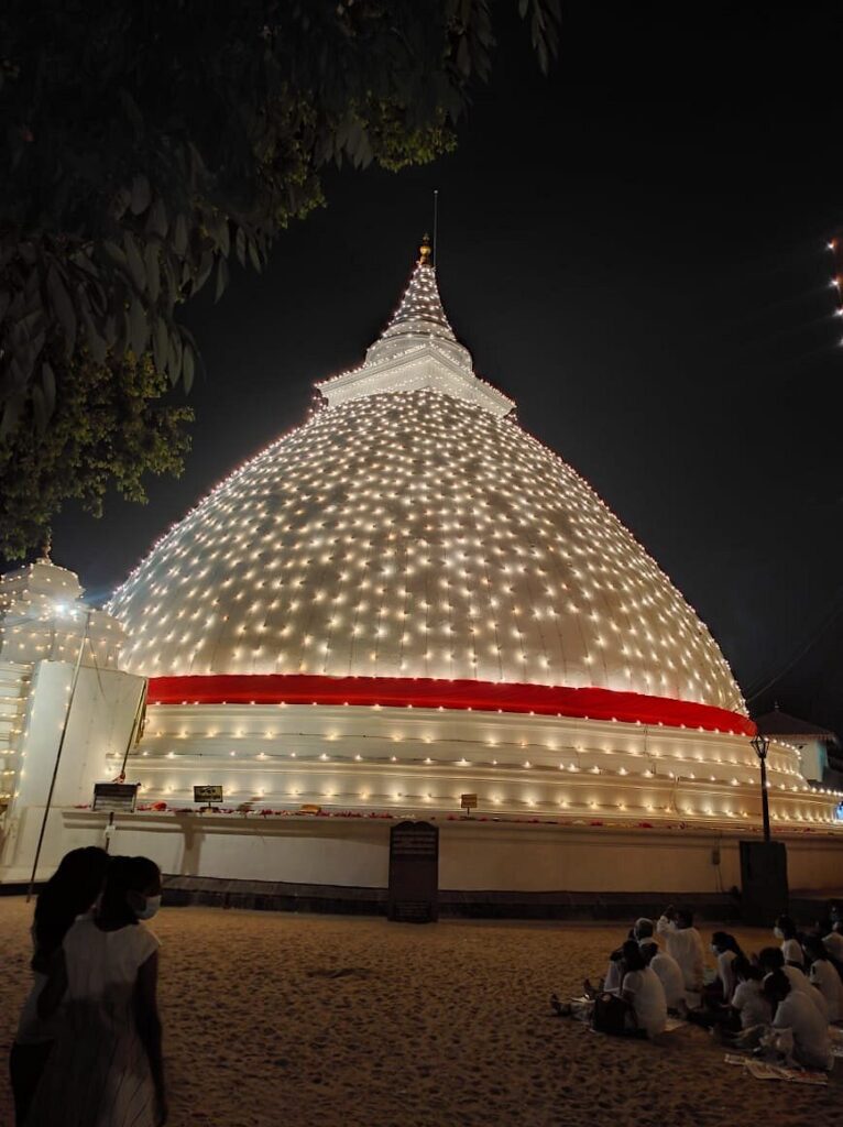 Stupa at Kelaniya Raja Maha Viharaya at night in Festival times